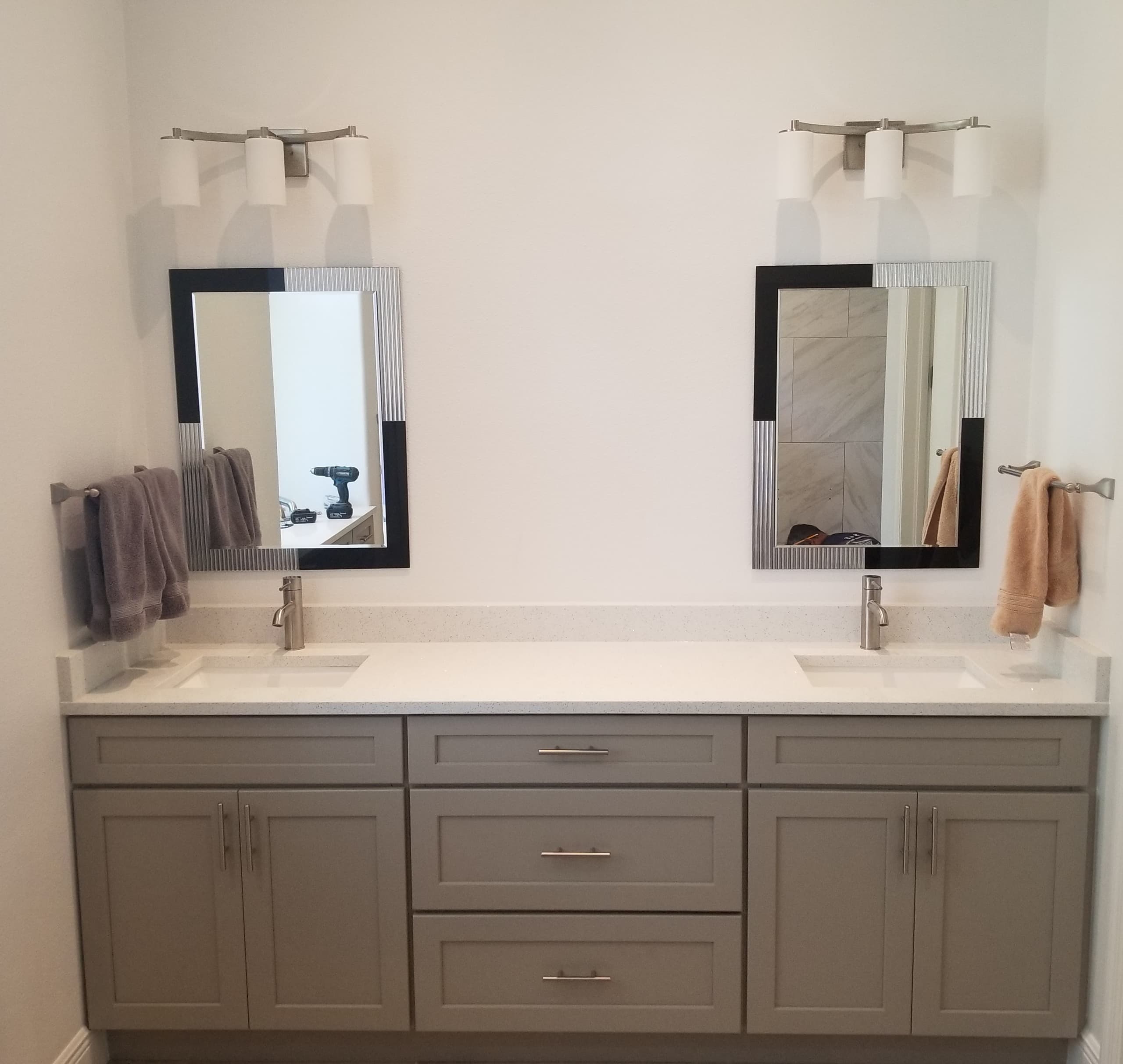 Double-sink grey shaker vanity with modern mirrors