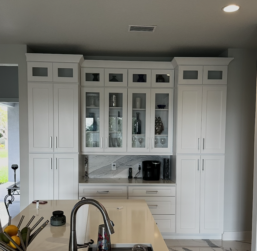 White shaker coffee bar with glass uppers