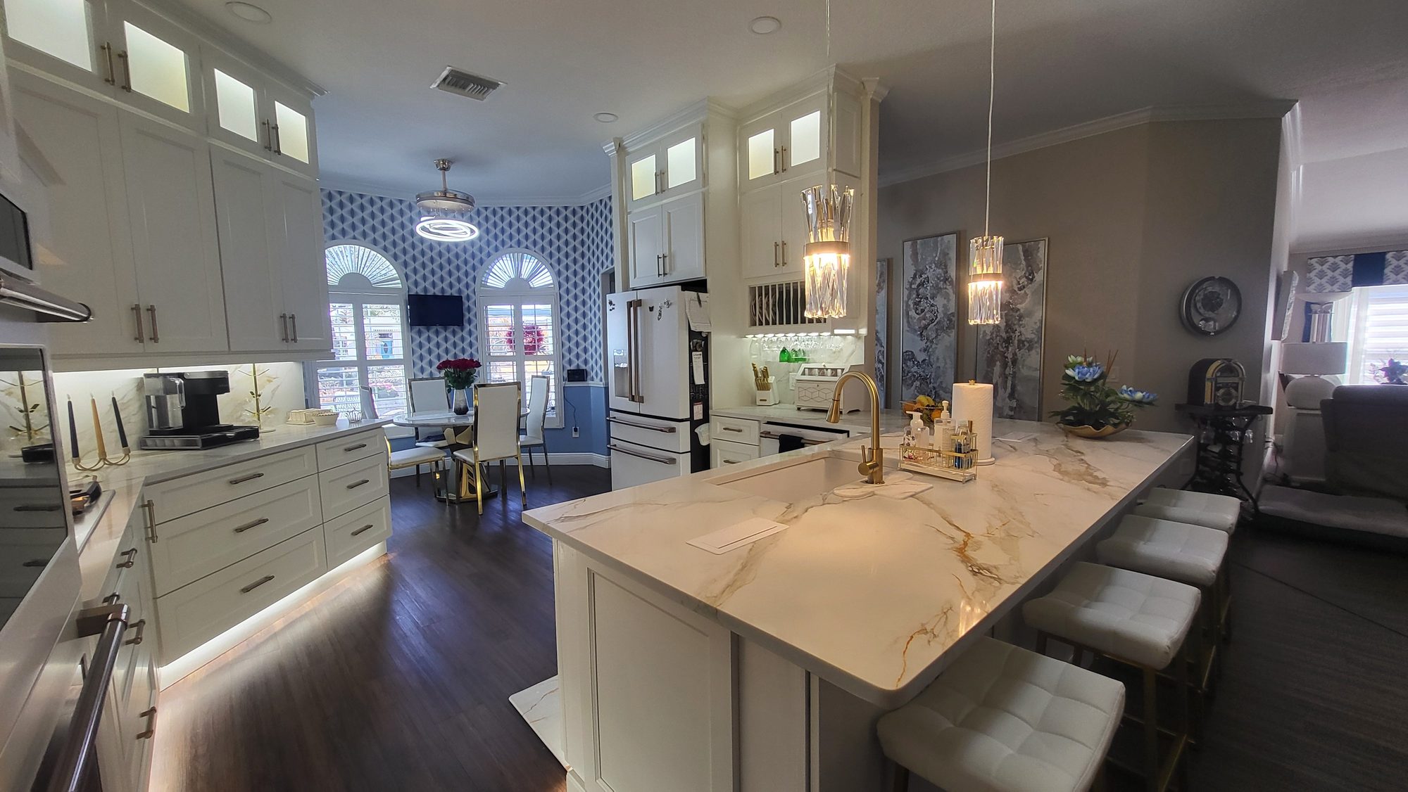 White kitchen with marble island